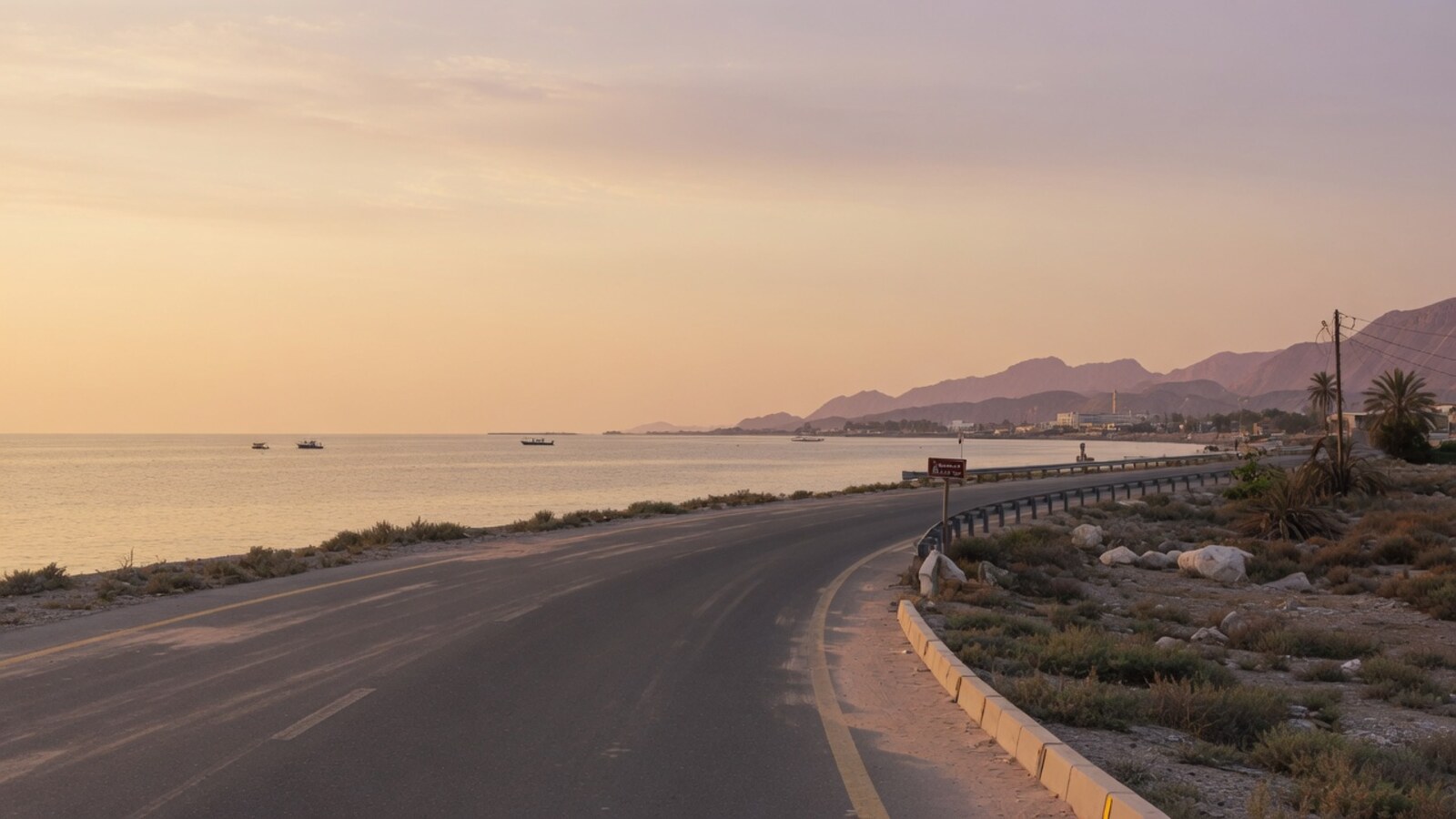 Northern emirate quiet coastal road soft evening light