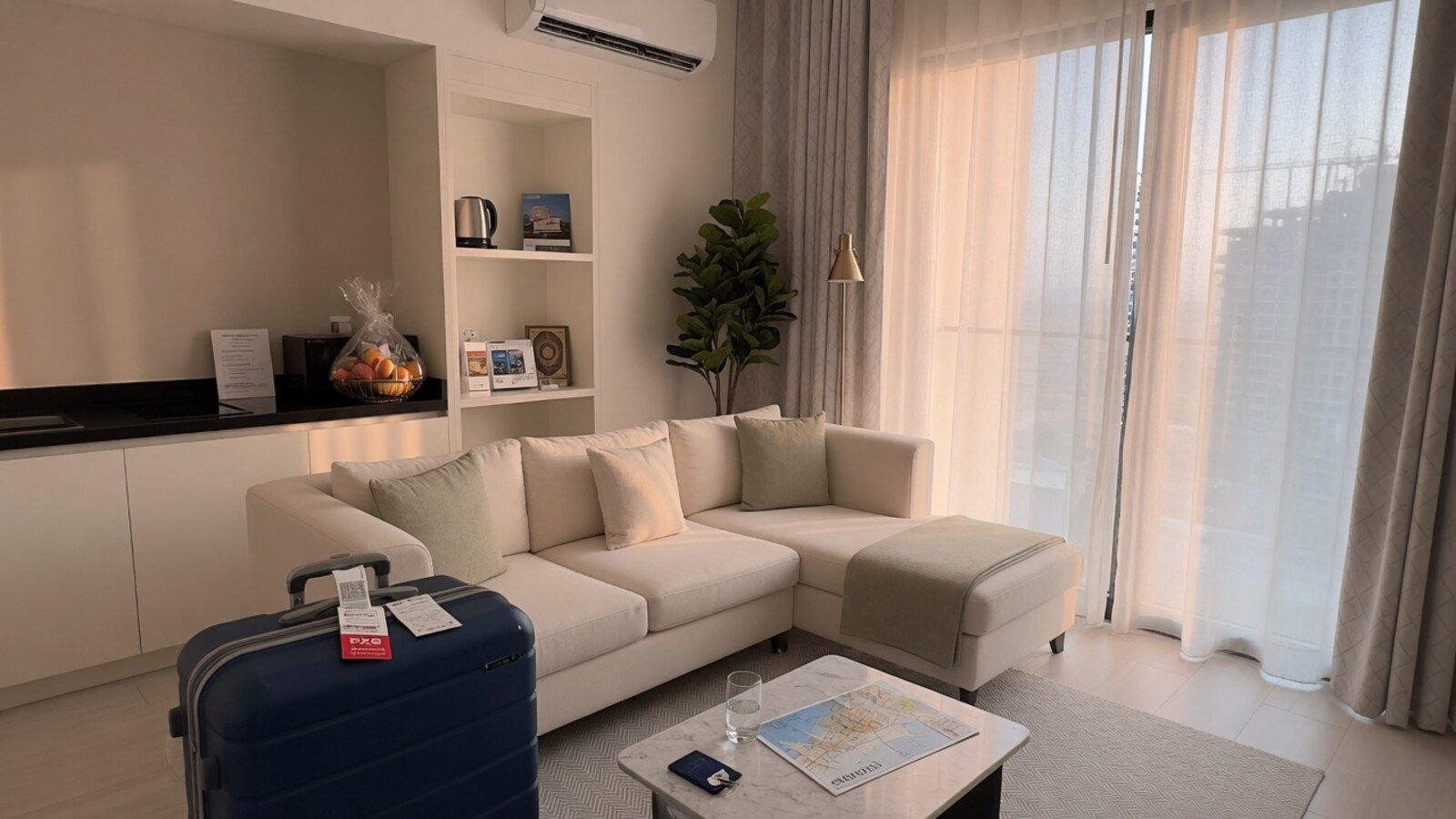 Serviced apartment living room with suitcase soft morning
