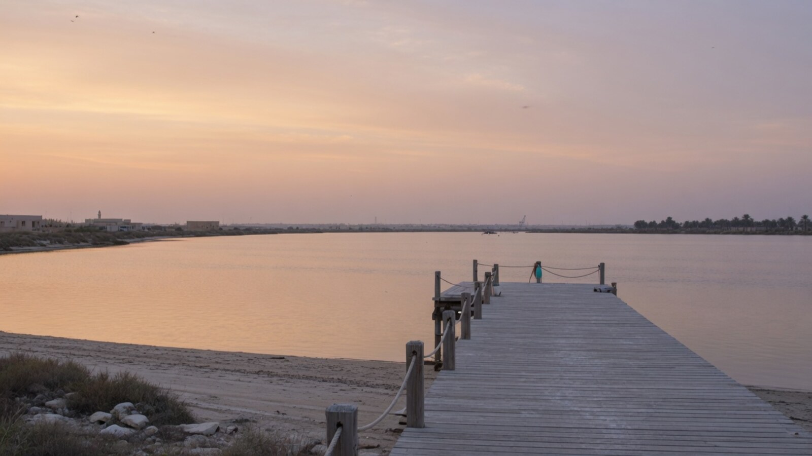 Quiet UAQ lagoon shoreline soft evening light for overloaded expats